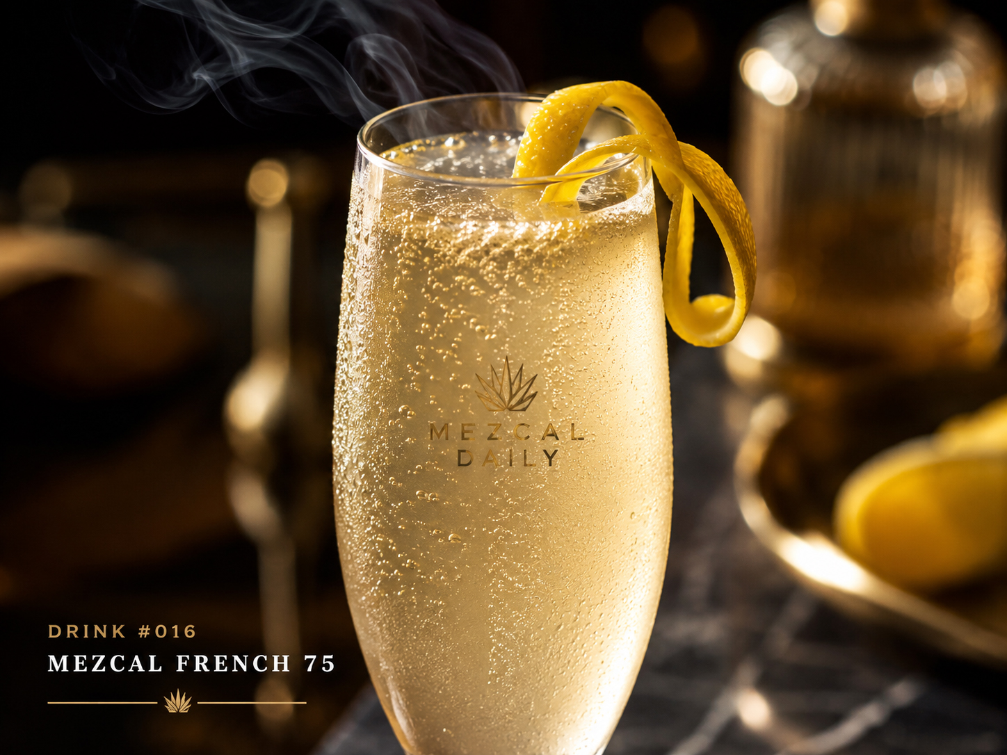 Close-up of the Mezcal French 75 with sparkling bubbles, lemon twist, and smoke.